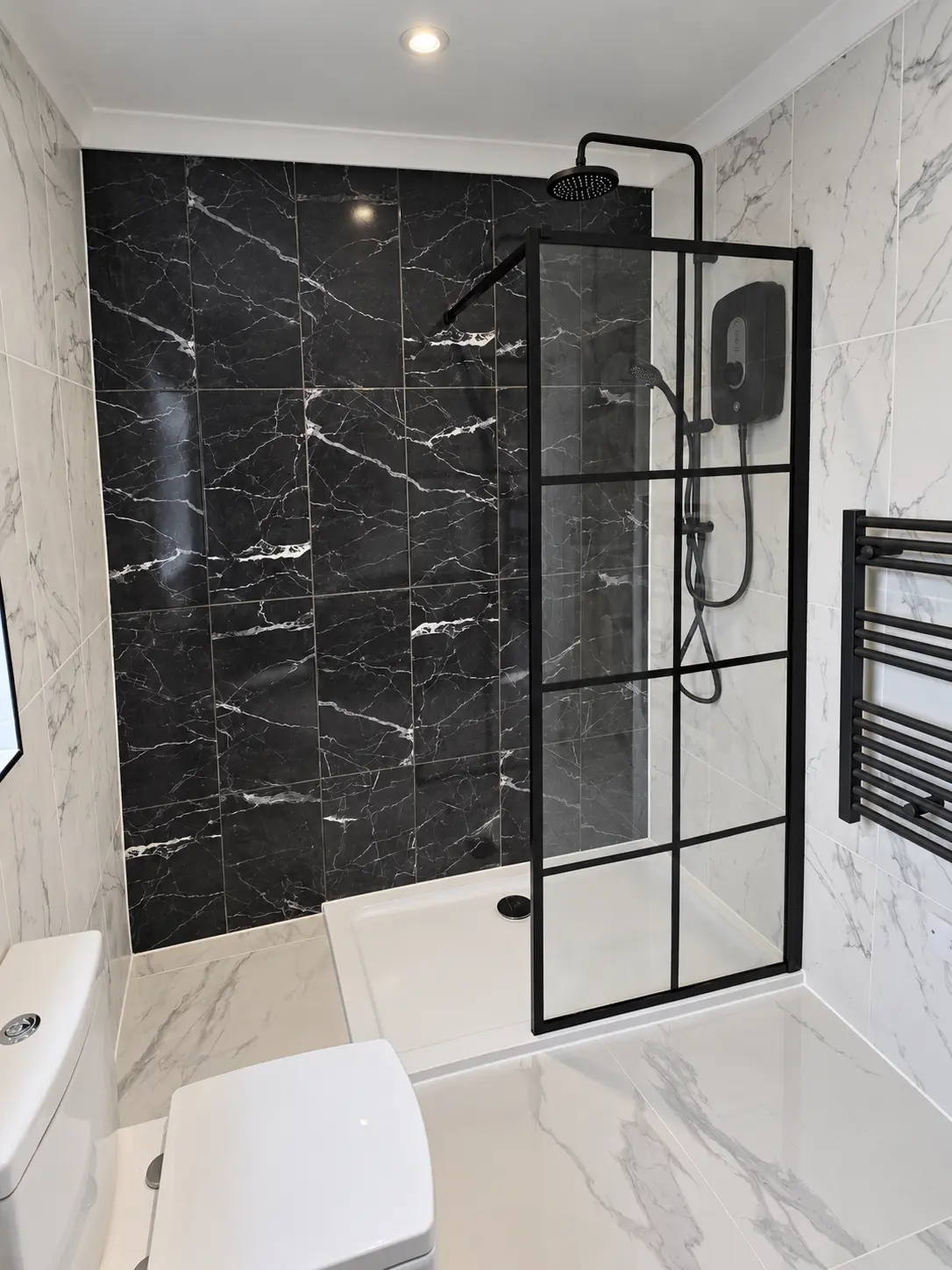 Completed black and white shower enclosure